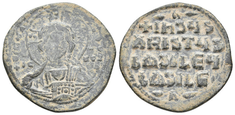 Front and back of Ancient Byzantine Coin with Jesus Christ Bronze Follis dating 976-1025 AD 