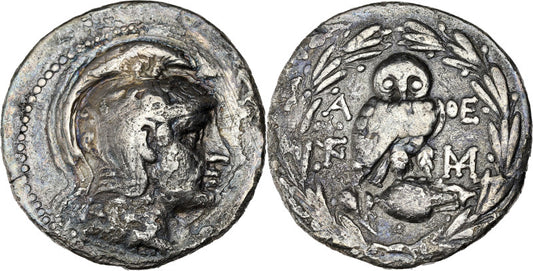 Back and front of an ancient greek new style silver  tetradrachm coin with Athena on front and owl on amphora jar on back
