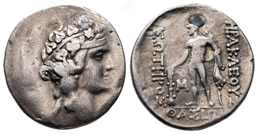 Ancient greek  silver tetradrachm coin with a portrait  of young dionysus on one side herakles on other